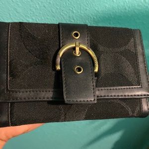 Used coach wallet minor wear in tear on belt see picture good condition